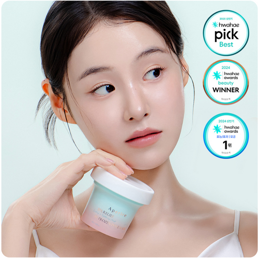 Young woman with clear skin holding Aperire Spa Relief Frozen Pore Mask, beauty awards badges visible